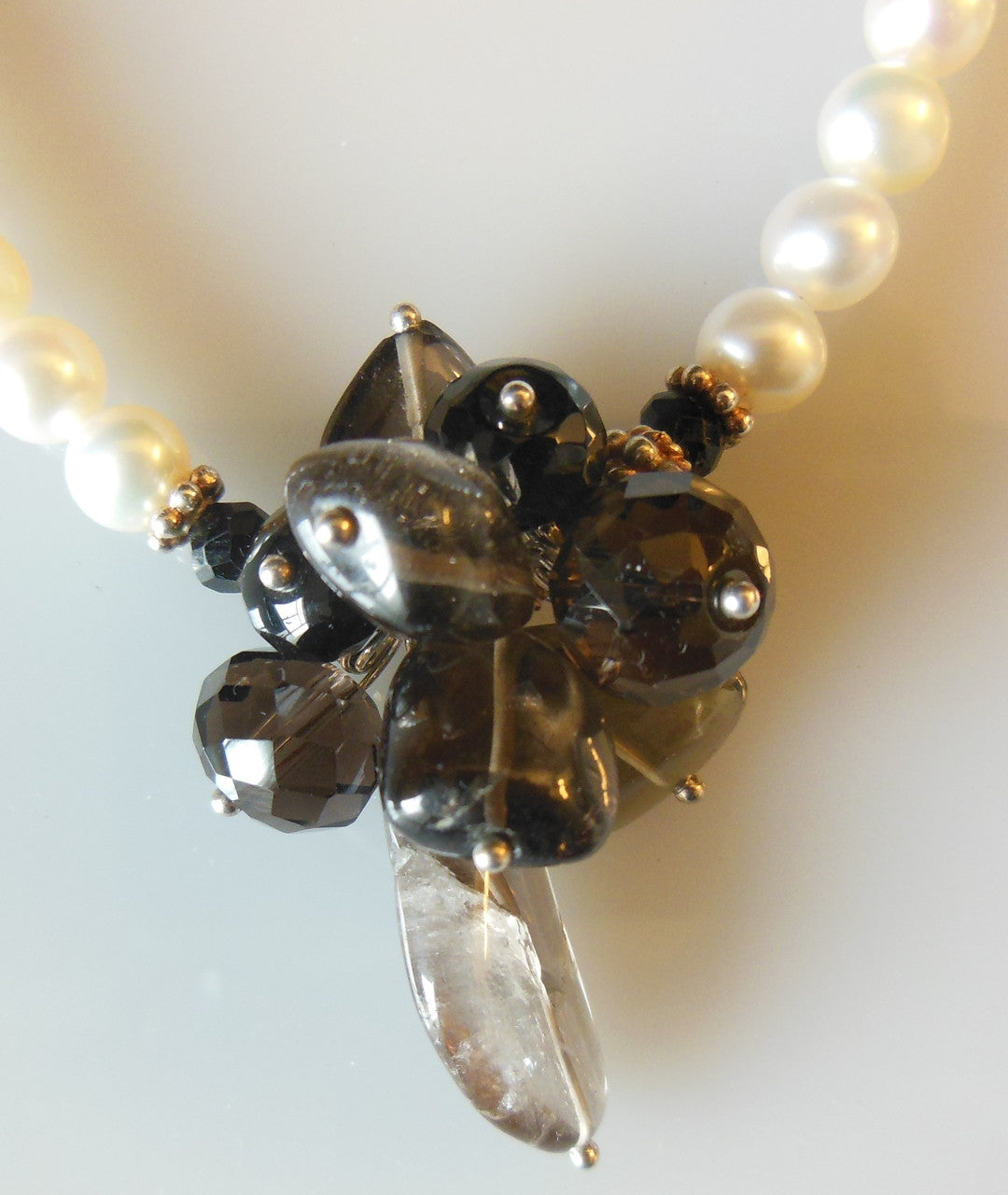 Smoky quartz cluster on white pearls-0