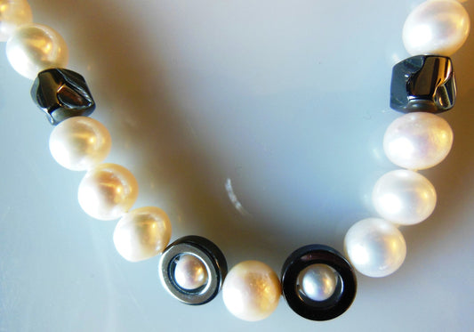 Hematite Circles and asymetric beads on white pearls