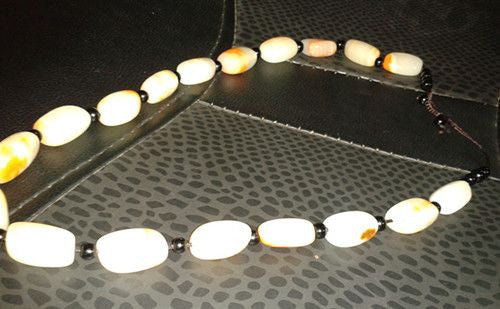 Jade beaded necklace from China.  Black and cream with shades of bronze.-7