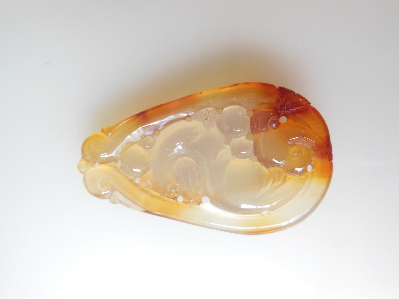 Jade pendant. Carved in swirls called Essence.  Lovely shades of bronze.-1